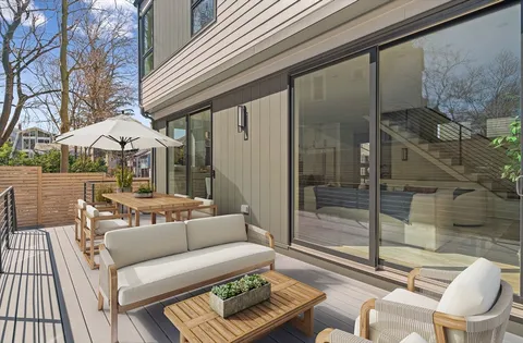 a outdoor space with patio the couches and a potted plant on a table