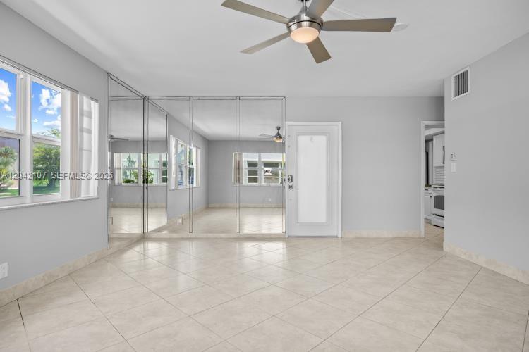 3213 Colony Club Road, Unit 3E Pompano Beach, FL 33062 - Photo 13 of 31 a view of an empty room with a window
