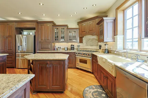 a kitchen with a stove a sink and a refrigerator