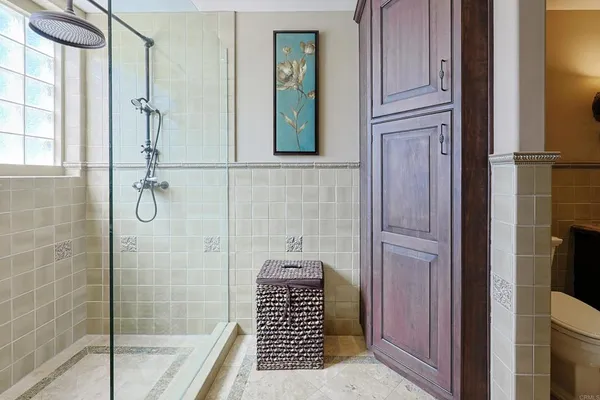 a view of a balcony with chairs potted plants