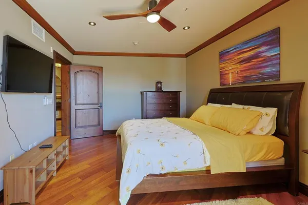 a vase with flowers sitting on a table with painted walls