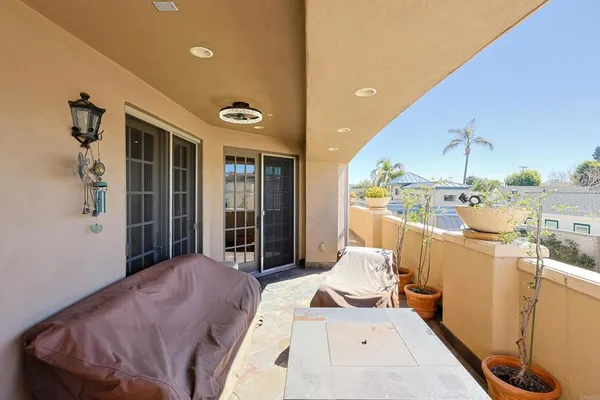 a view of a balcony with chairs