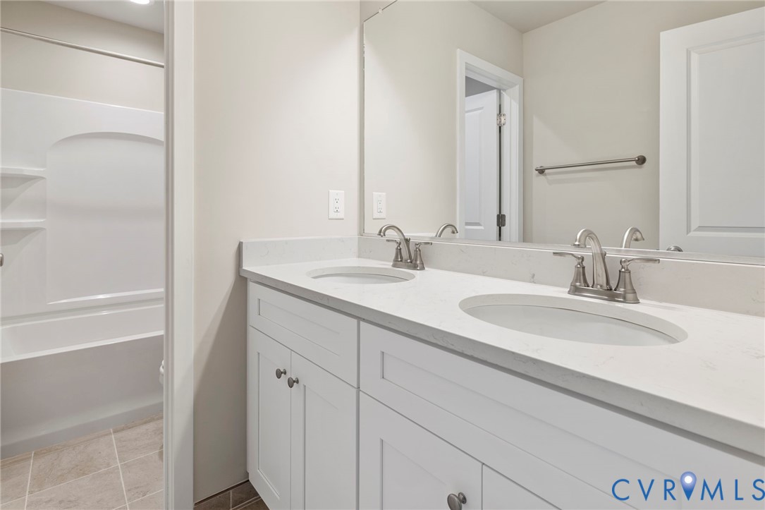 8201 Excaliber Place North Chesterfield, VA 23237 - Photo 10 of 12 a bathroom with a sink and a mirror