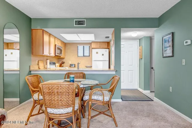 a kitchen with a sink stove and refrigerator