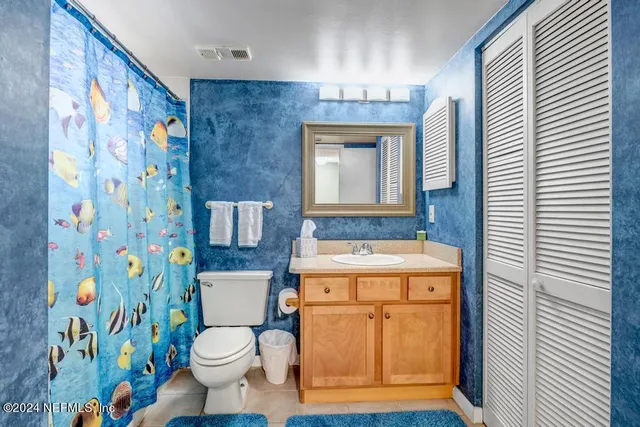 a bathroom with a sink a mirror and a shower