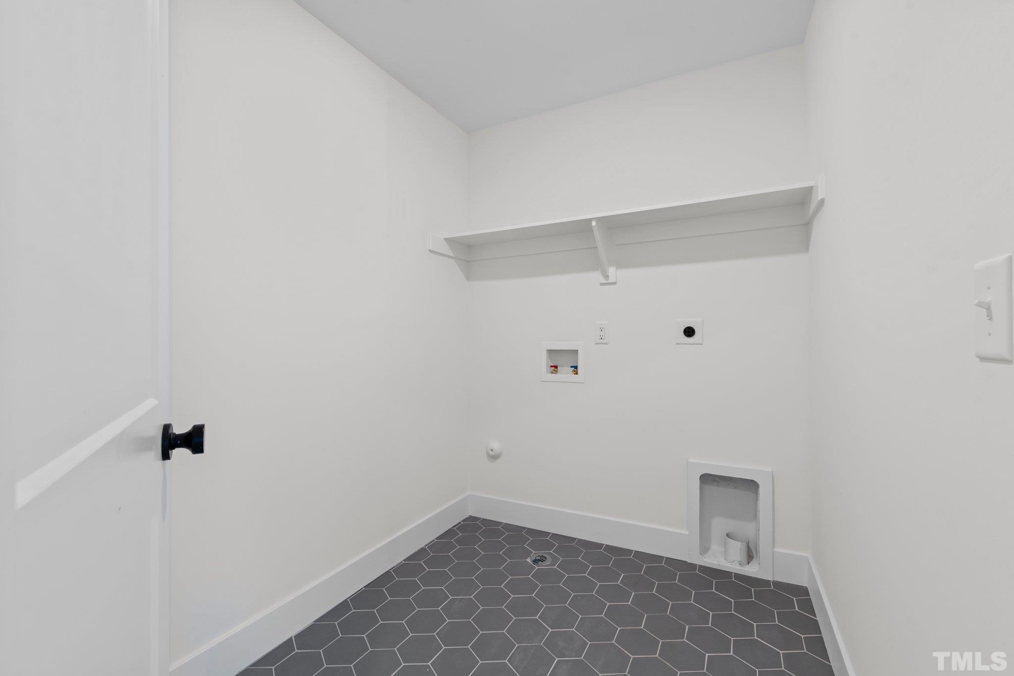 829 Cumberland Street, Unit 100 Raleigh, NC 27610 - Photo 19 of 31 a view of small space with racks on the wall