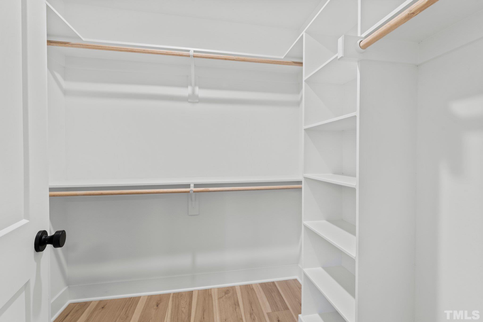 829 Cumberland Street, Unit 100 Raleigh, NC 27610 - Photo 28 of 31 a view of walk in closet with empty racks