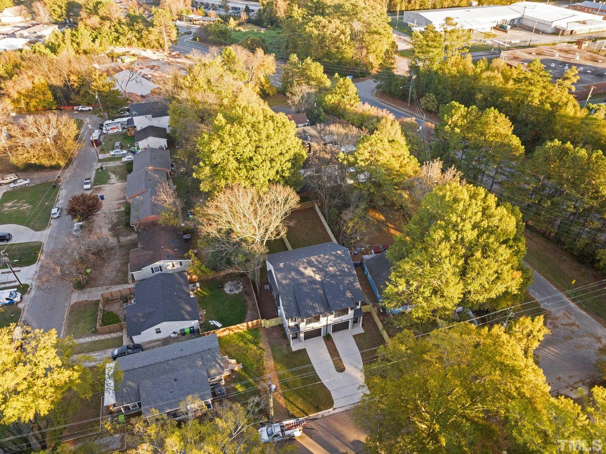 829 Cumberland Street, Unit 100 Raleigh, NC 27610 - Photo 7 of 31 an aerial view of residential houses with outdoor space