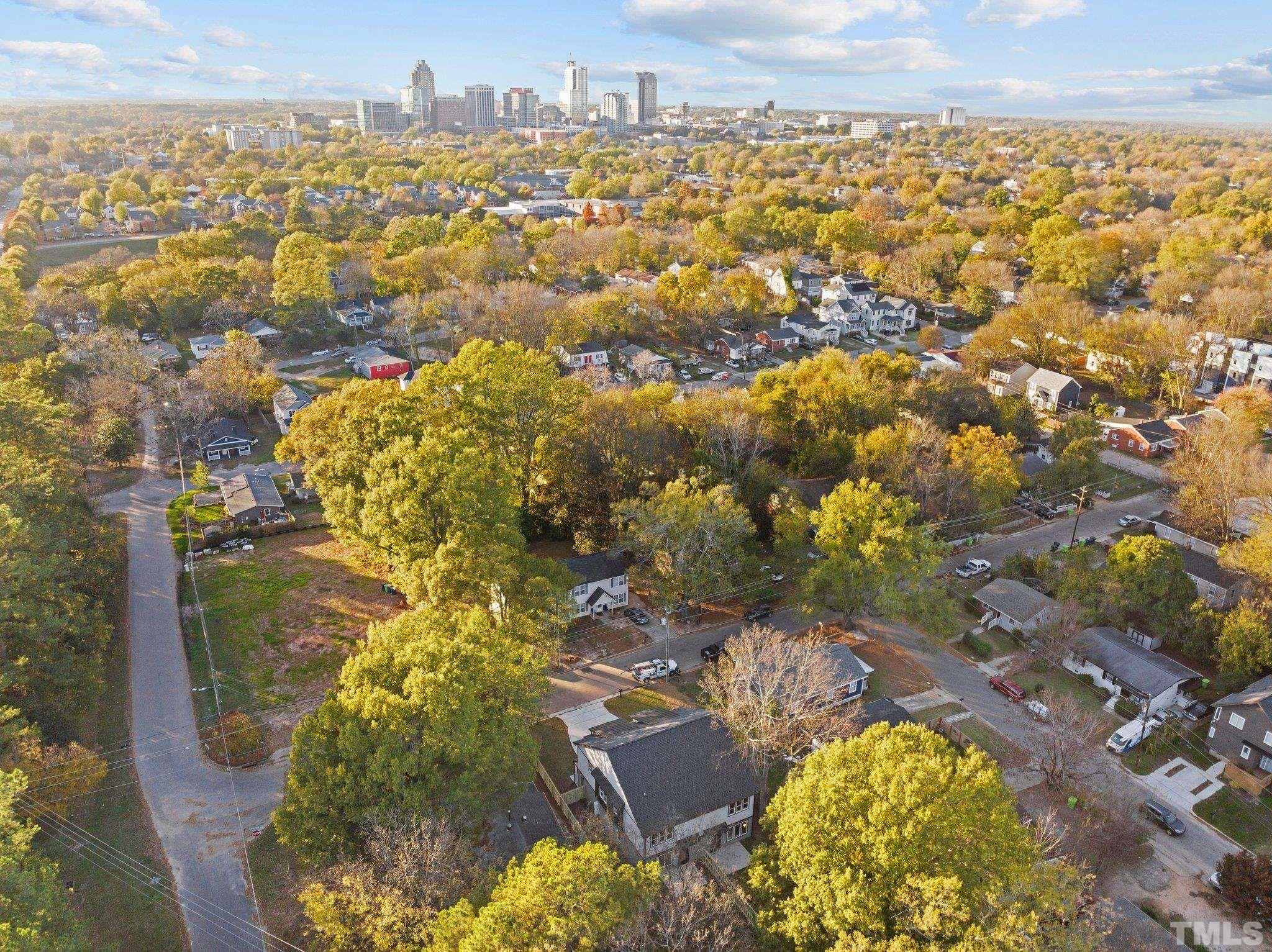 829 Cumberland Street, Unit 100 Raleigh, NC 27610 - Photo 8 of 31 an aerial view of residential houses with outdoor space