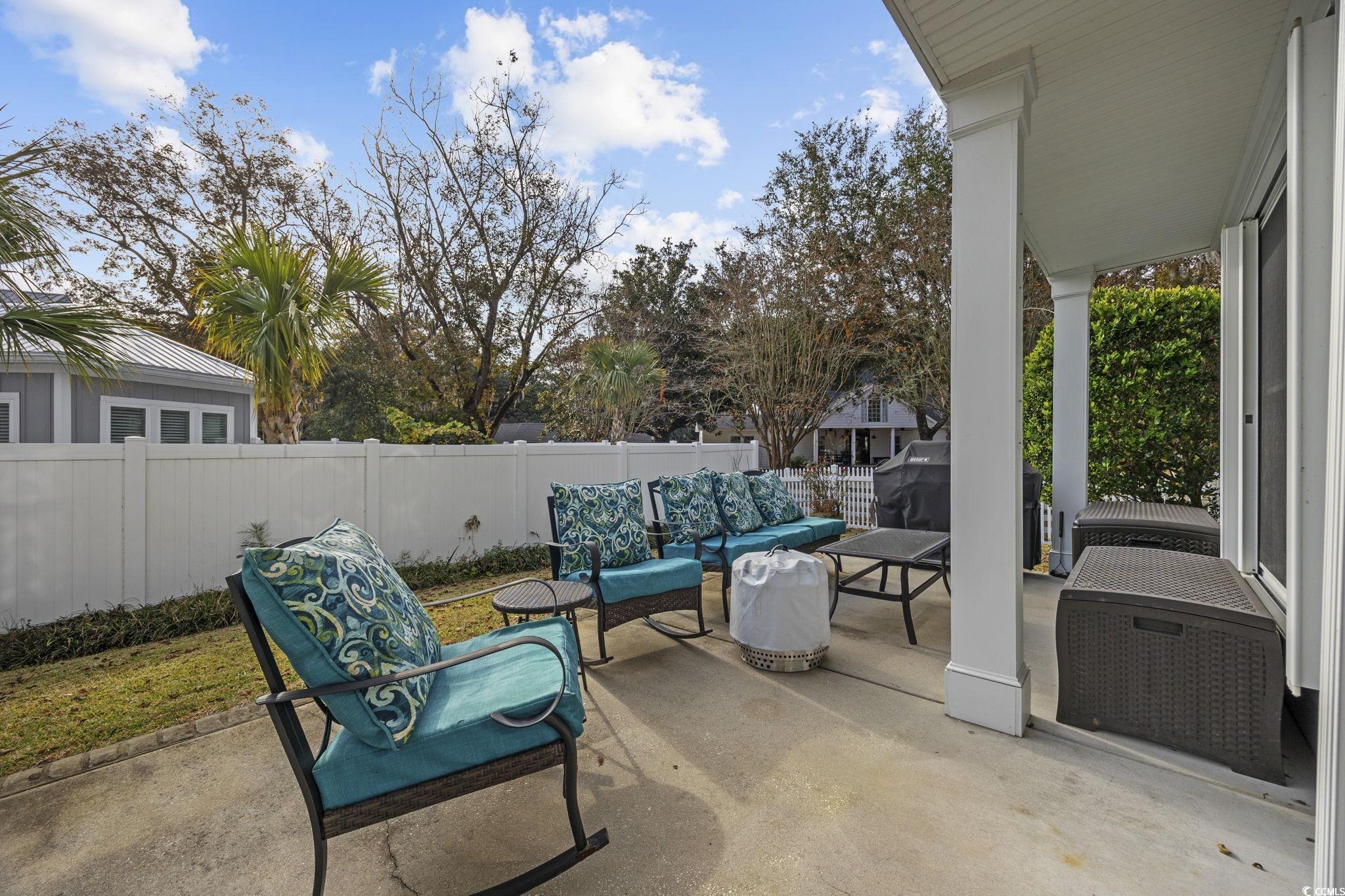 4398 Murrells Inlet Road Murrells Inlet, SC 29576 - Photo 31 of 38 Fenced backyard with a patio area, an outdoor hangout area, and grilling area