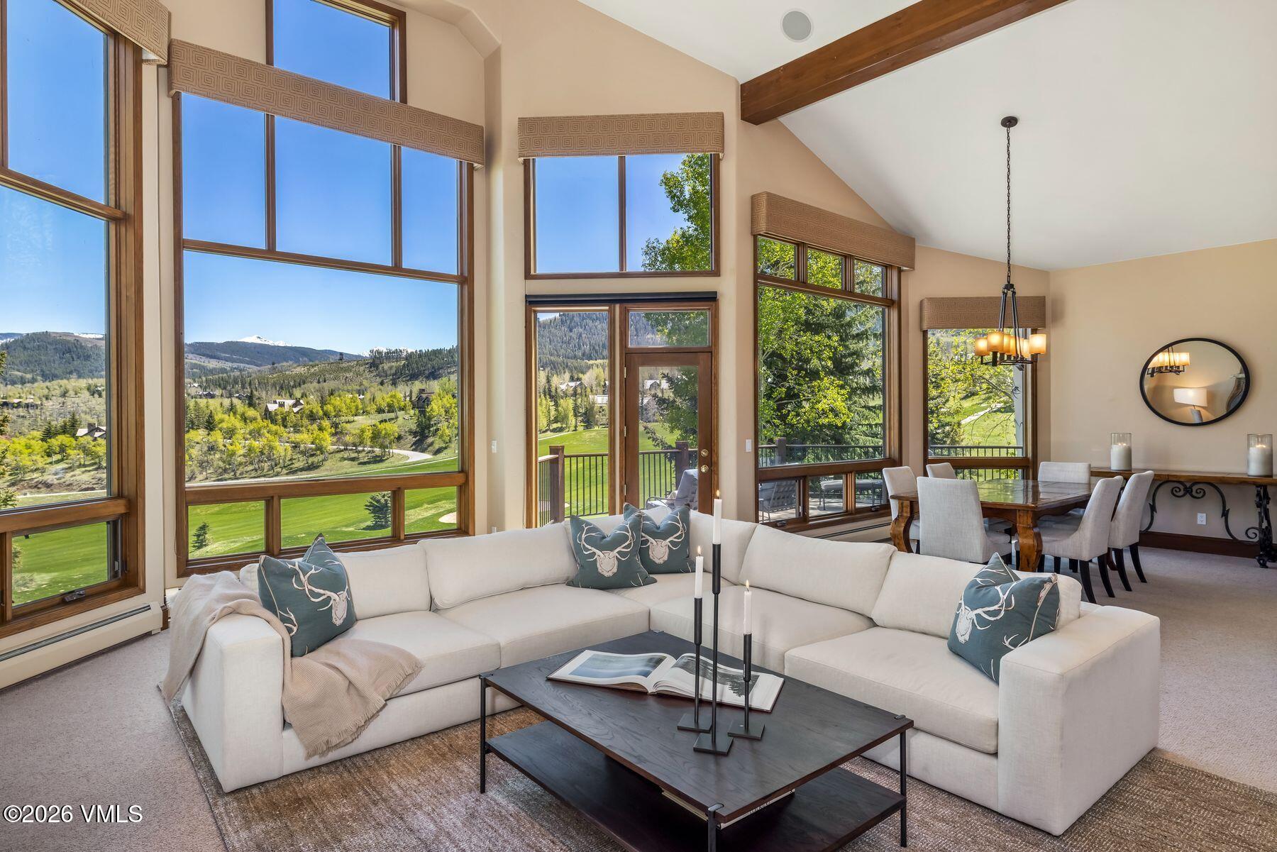 167 Saddle Ridge Edwards, CO 81632 - Photo 3 of 41 a living room with furniture ceiling fan and a large window