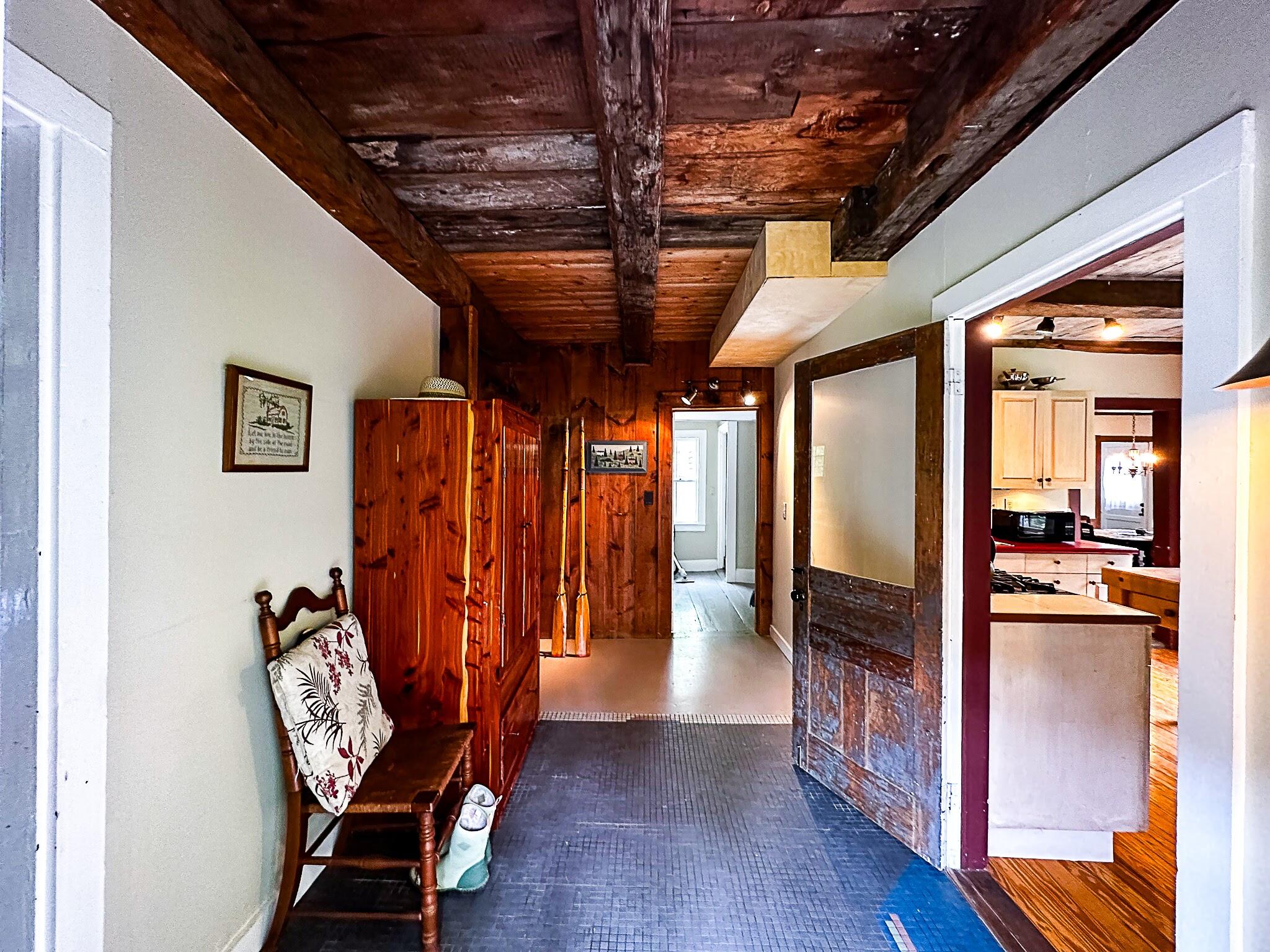 1319 Newbury Neck Road Surry, ME 04684 - Photo 6 of 68 Entry mudroom w/kitchen at right.