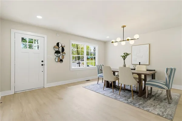 an dining room with furniture and window
