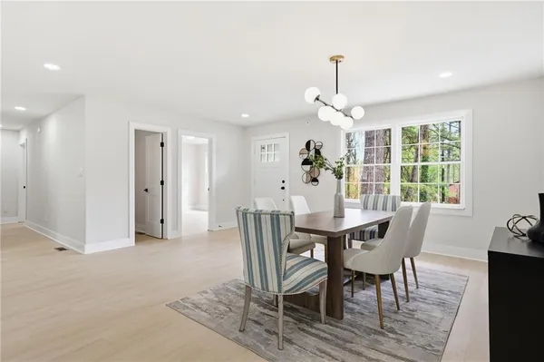 a view of a dining room with furniture window and outside view