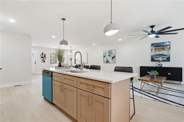 a kitchen with sink and center