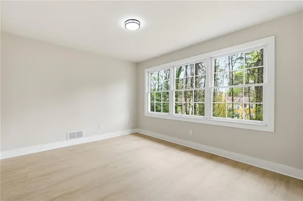 an empty room with closet area