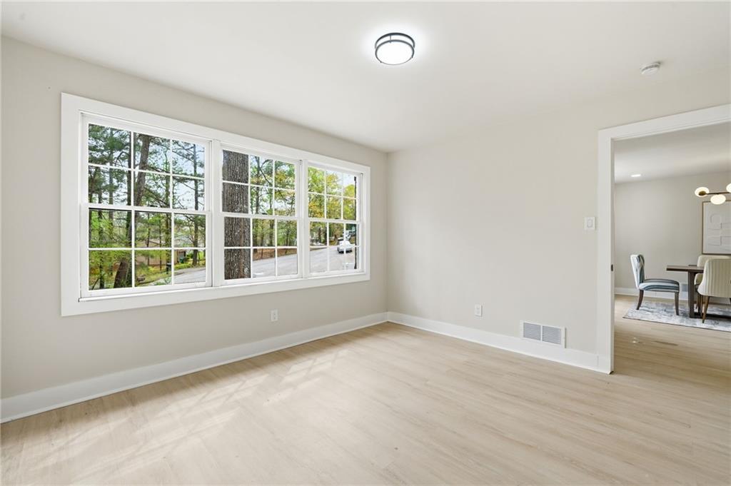 4158 Marist Court Decatur, GA 30034 - Photo 29 of 34 an empty room with wooden floor and windows