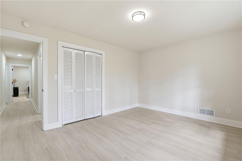4158 Marist Court Decatur, GA 30034 - Photo 30 of 34 an empty room with wooden floor and windows