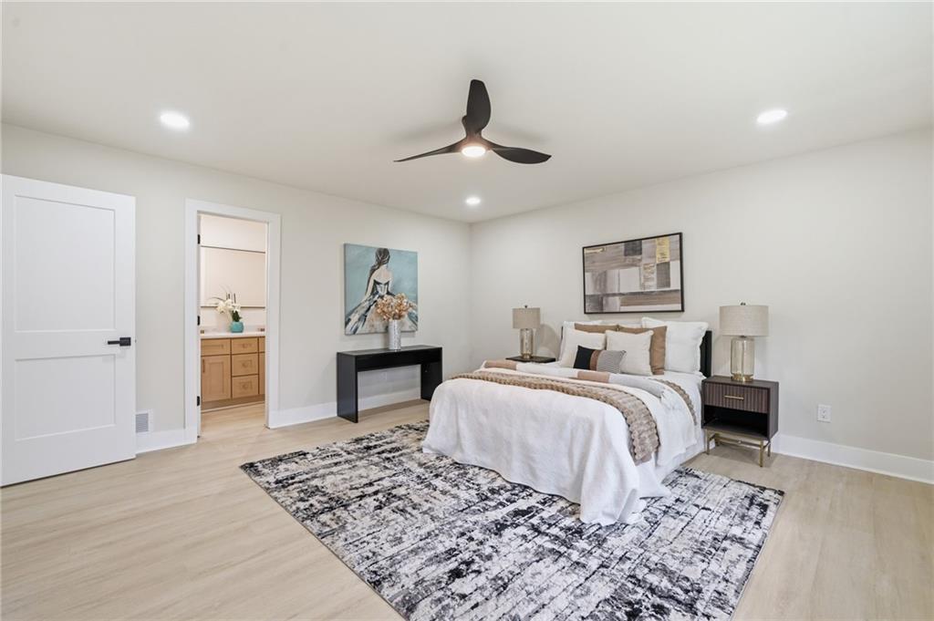 4158 Marist Court Decatur, GA 30034 - Photo 5 of 34 a bedroom with a large bed and a chandelier