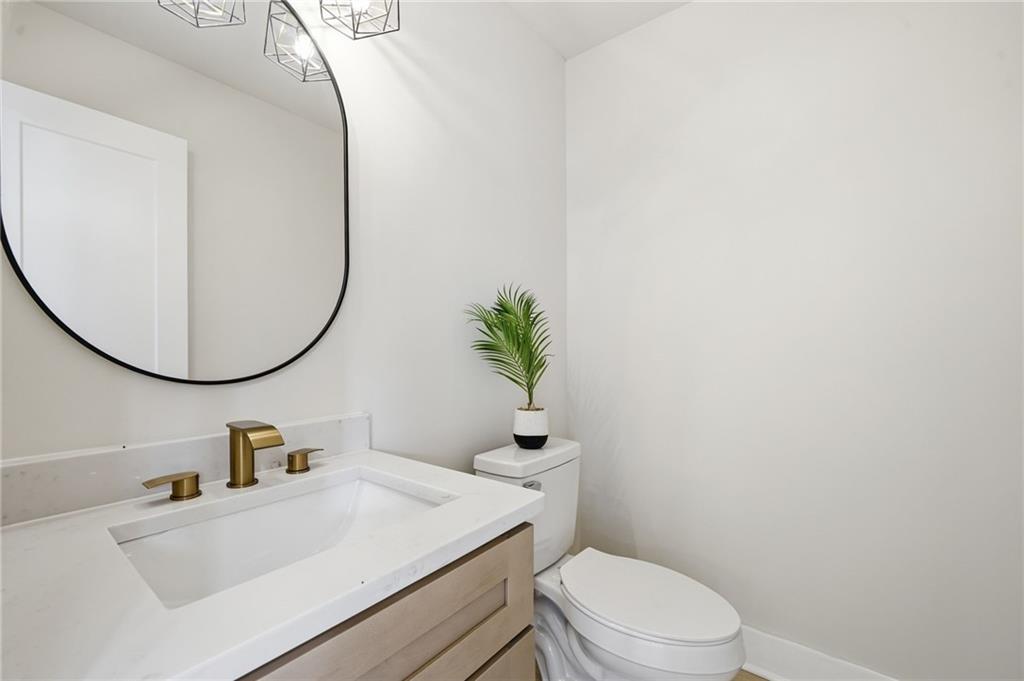 4158 Marist Court Decatur, GA 30034 - Photo 9 of 34 a bathroom with a sink mirror vanity and toilet