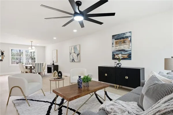 a living room with furniture and wooden floor