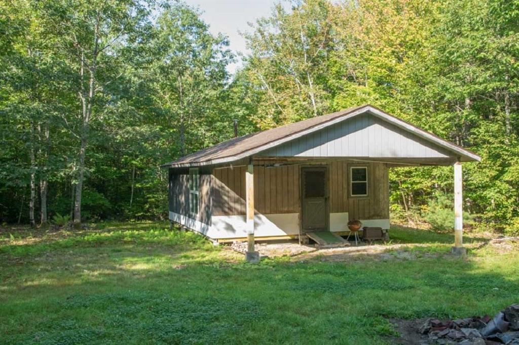 69 Harlin Road Garland, ME 04939 - Photo 7 of 14 Side view of deer camp