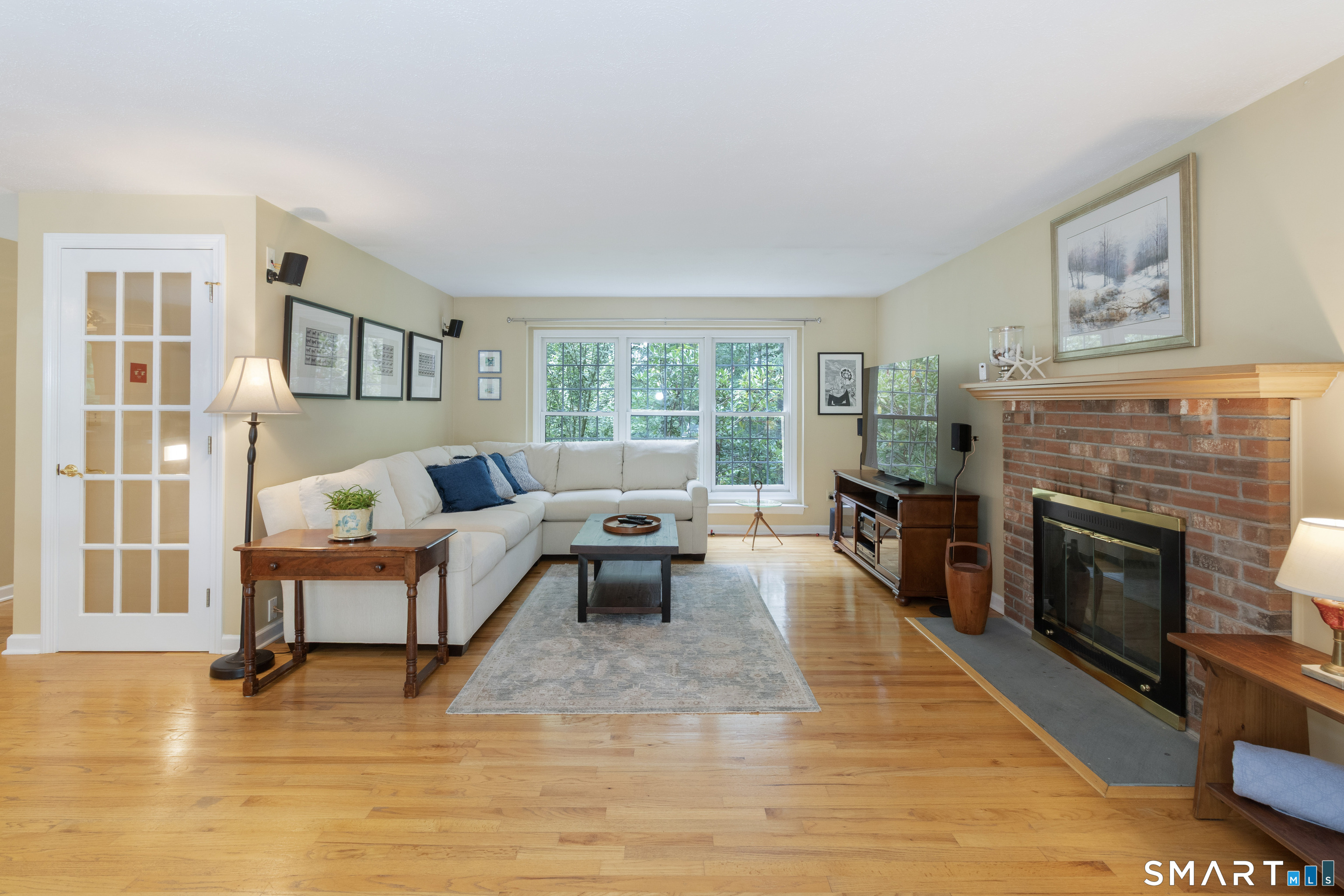 450 County Road Madison, CT 06443 - Photo 6 of 34 The Family Room, with a working wood burning fireplace.