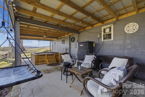 a view of a patio with table and chairs with wooden floor