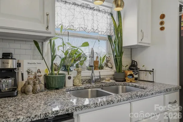 a kitchen with a sink and a window