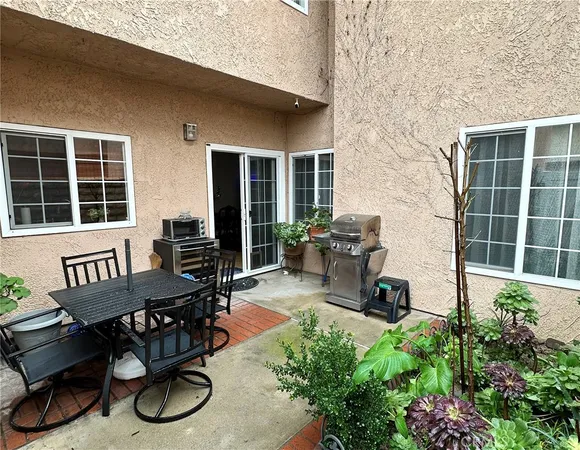 a view of a chairs and table in a patio