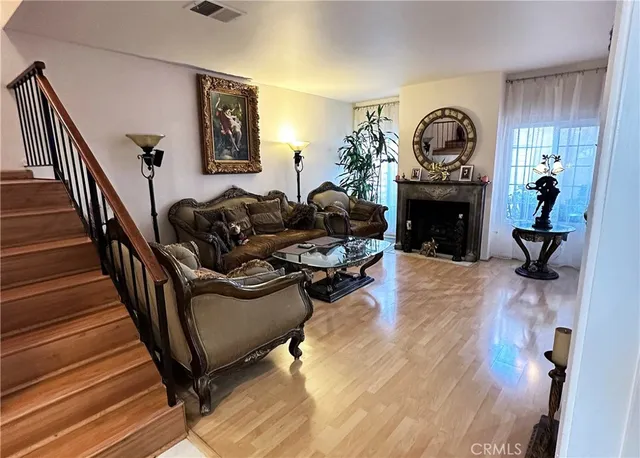 a living room with furniture and a fireplace