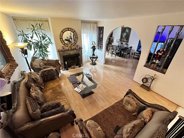 a living room with furniture fireplace and flat screen tv