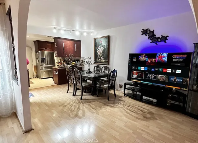 a view of a dining room with furniture and chandelier