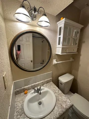 a bathroom with a sink and mirror