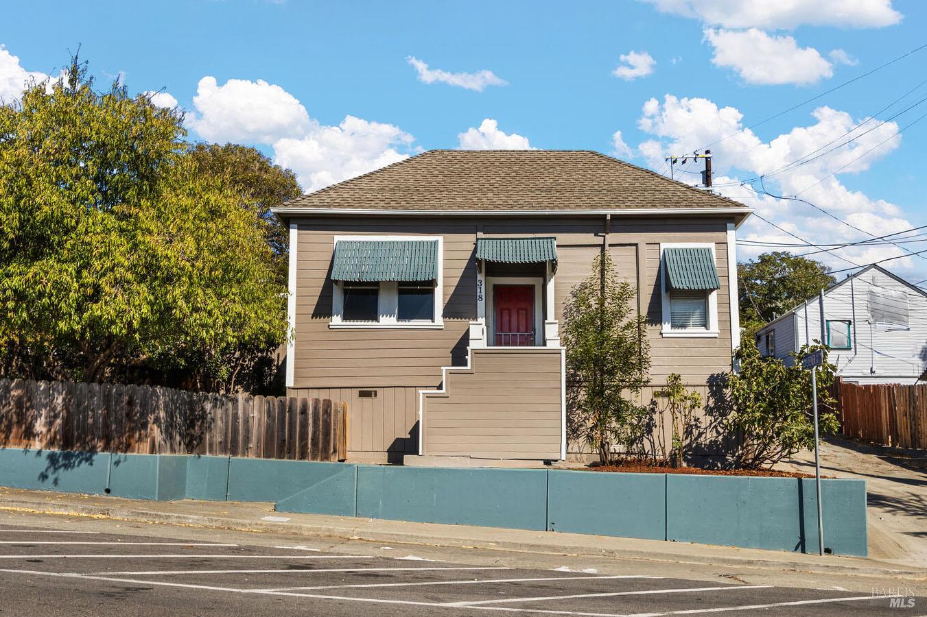 a front view of a house with a yard