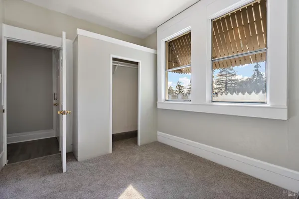 a view of an empty room with a window