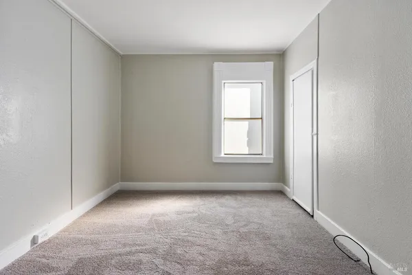 an empty room with windows