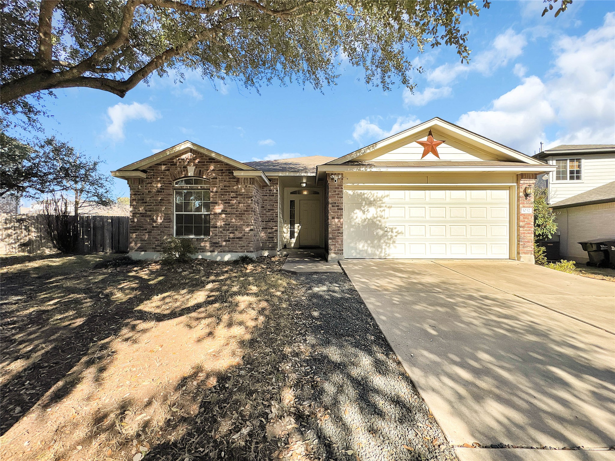 1032 Tudor House Road Pflugerville, TX 78660 - Photo 1 of 32 a front view of a house with a yard and garage