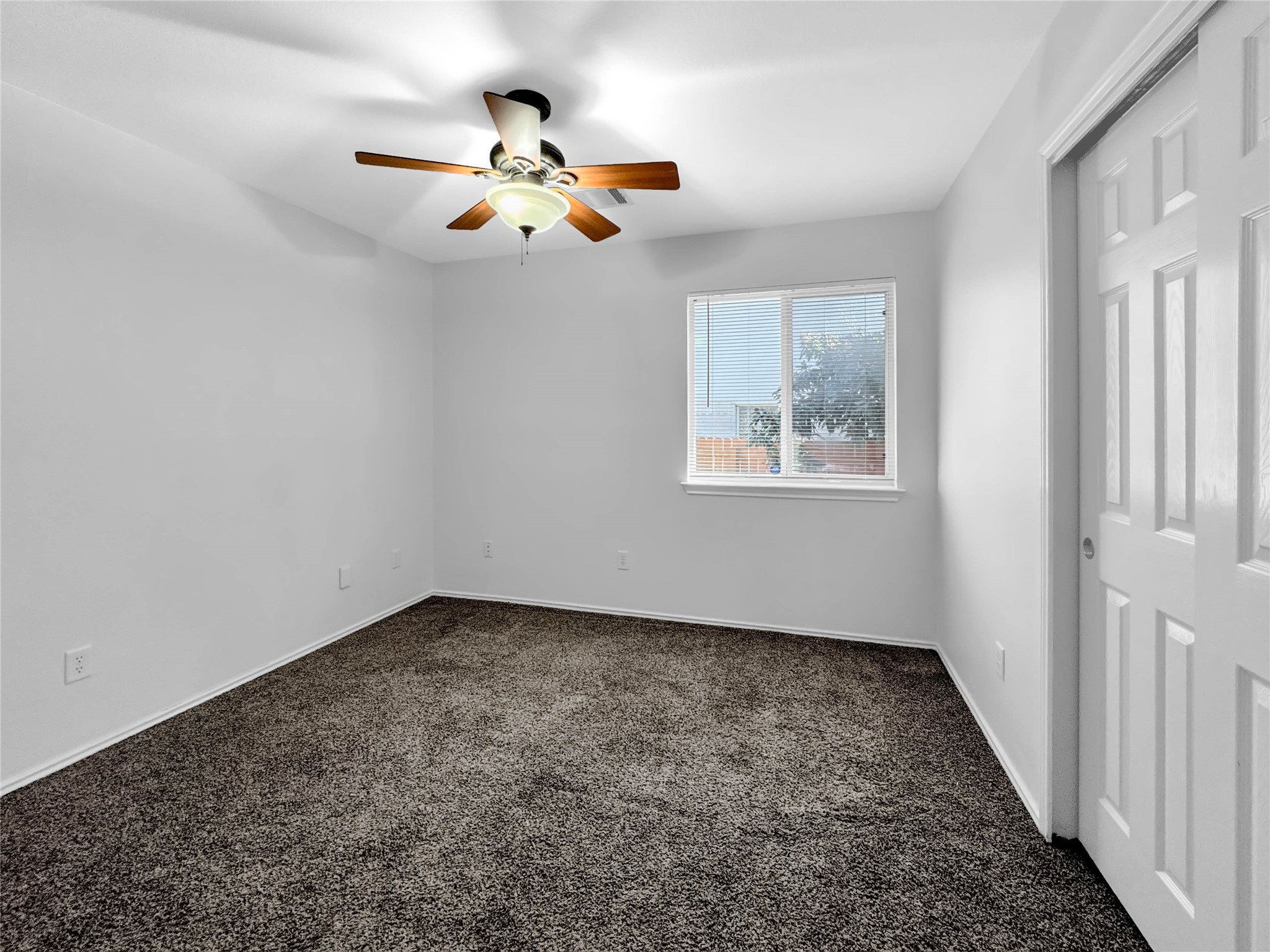 1032 Tudor House Road Pflugerville, TX 78660 - Photo 28 of 32 an empty room with windows and fan