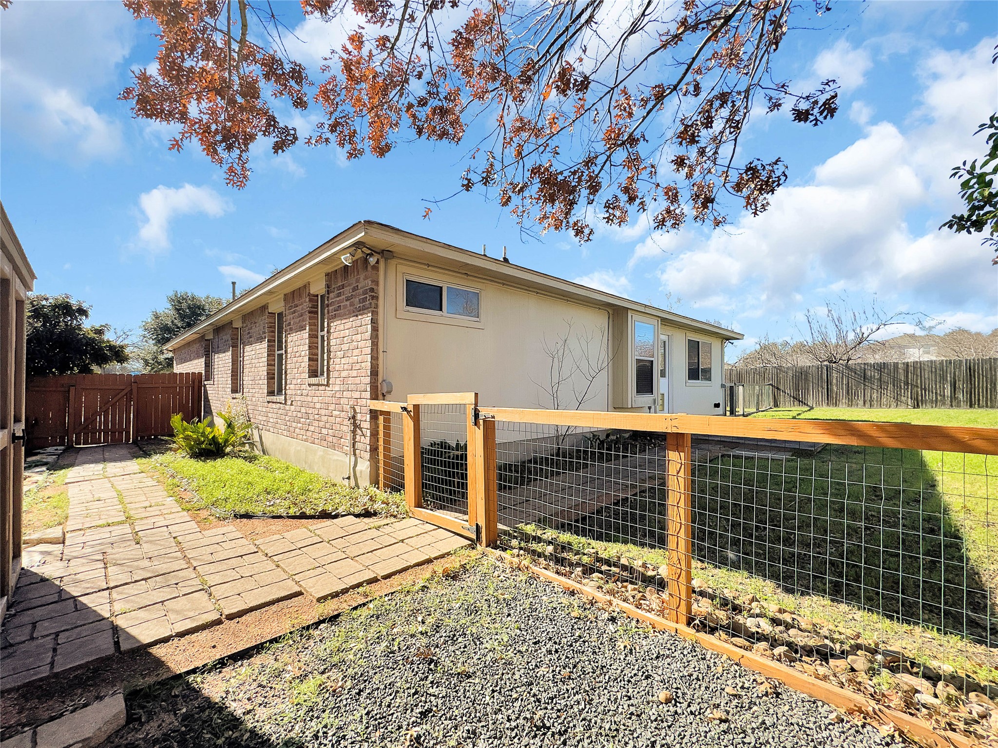 1032 Tudor House Road Pflugerville, TX 78660 - Photo 30 of 32 a front view of a house with a yard