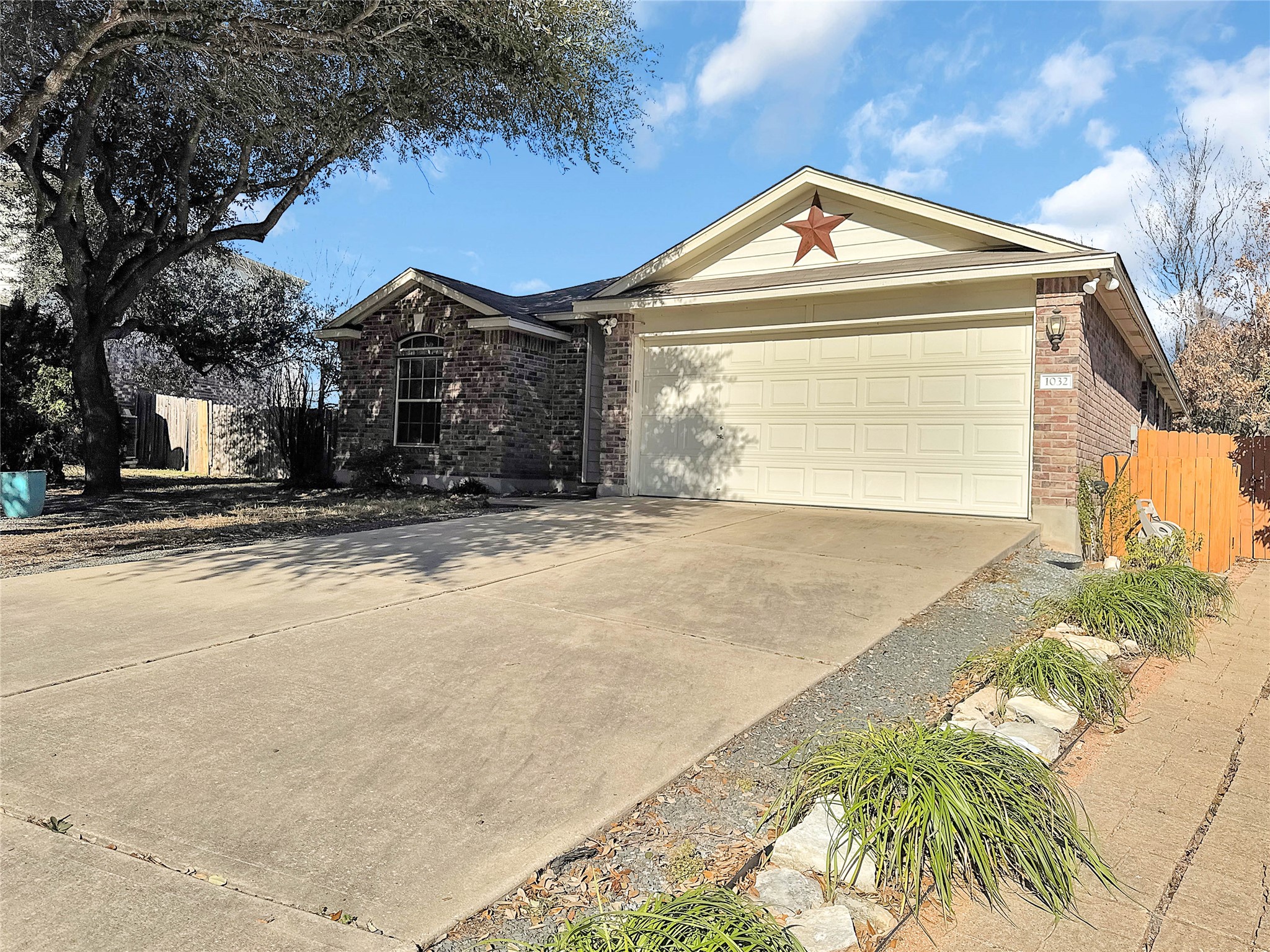 1032 Tudor House Road Pflugerville, TX 78660 - Photo 3 of 32 a front view of a house with a yard