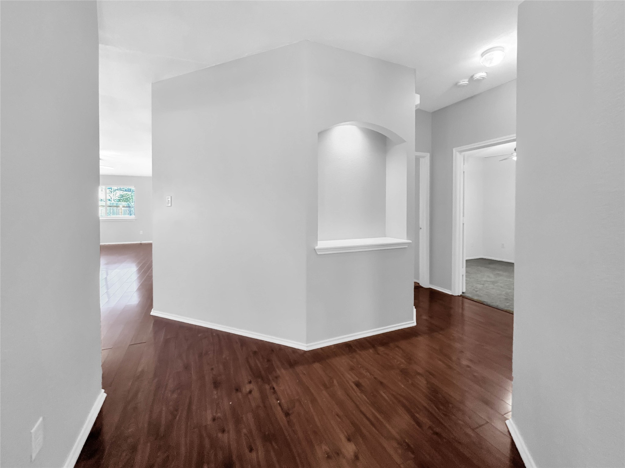 1032 Tudor House Road Pflugerville, TX 78660 - Photo 10 of 32 an empty room with wooden floor and windows