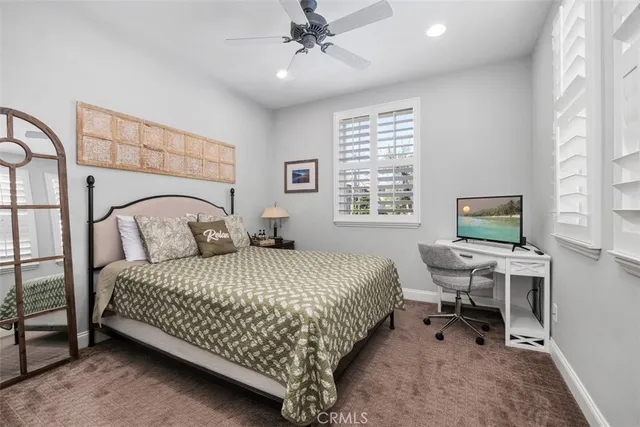 a bedroom with a bed and a desk