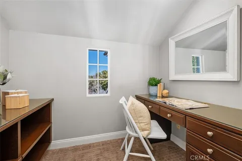 a view of a workspace with furniture