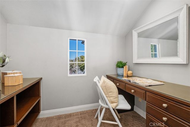 a view of a workspace with furniture