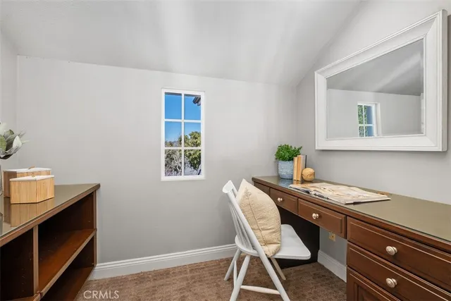 a view of a workspace with furniture