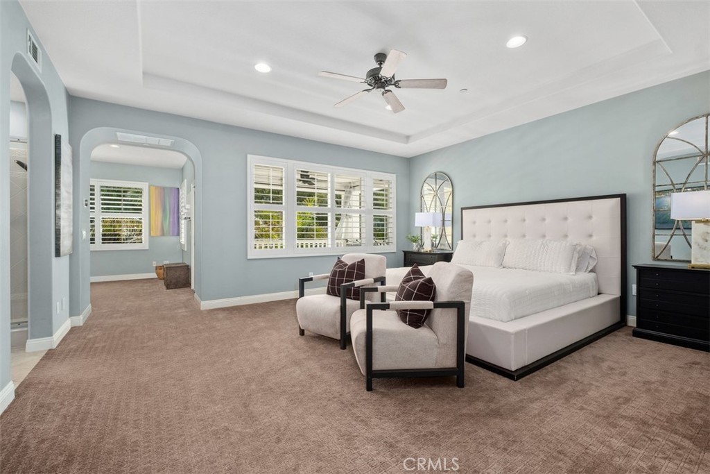 20 Bentley Road Coto de Caza, CA 92679 - Photo 18 of 29 a spacious bedroom with a bed and glass windows