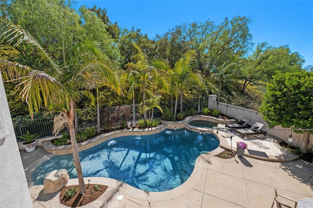 20 Bentley Road Coto de Caza, CA 92679 - Photo 21 of 29 a view of backyard with swimming pool and furniture