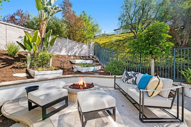 a backyard of a house with table and chairs