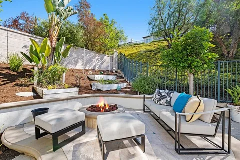 a outdoor living space with furniture and a potted plant